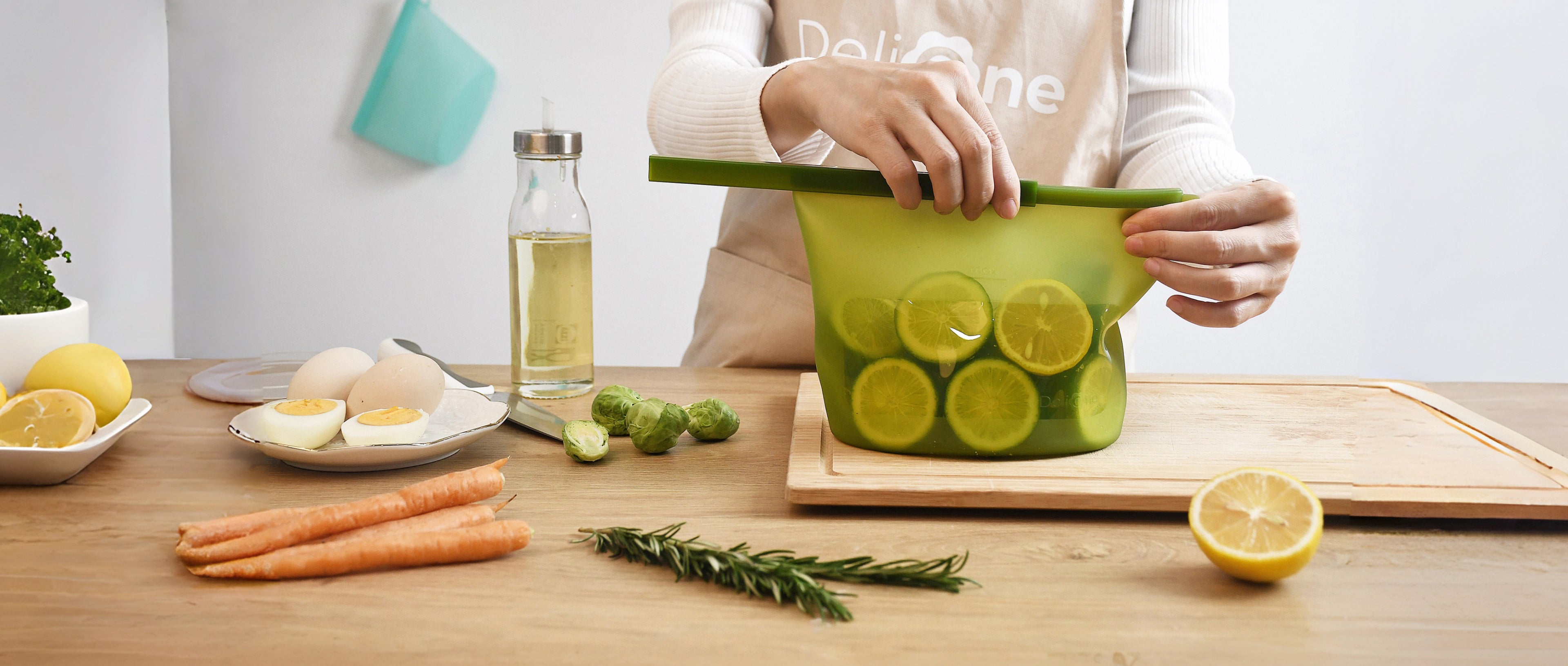 Minimalist food storage scene with DeliOne silicone containers and fresh ingredients