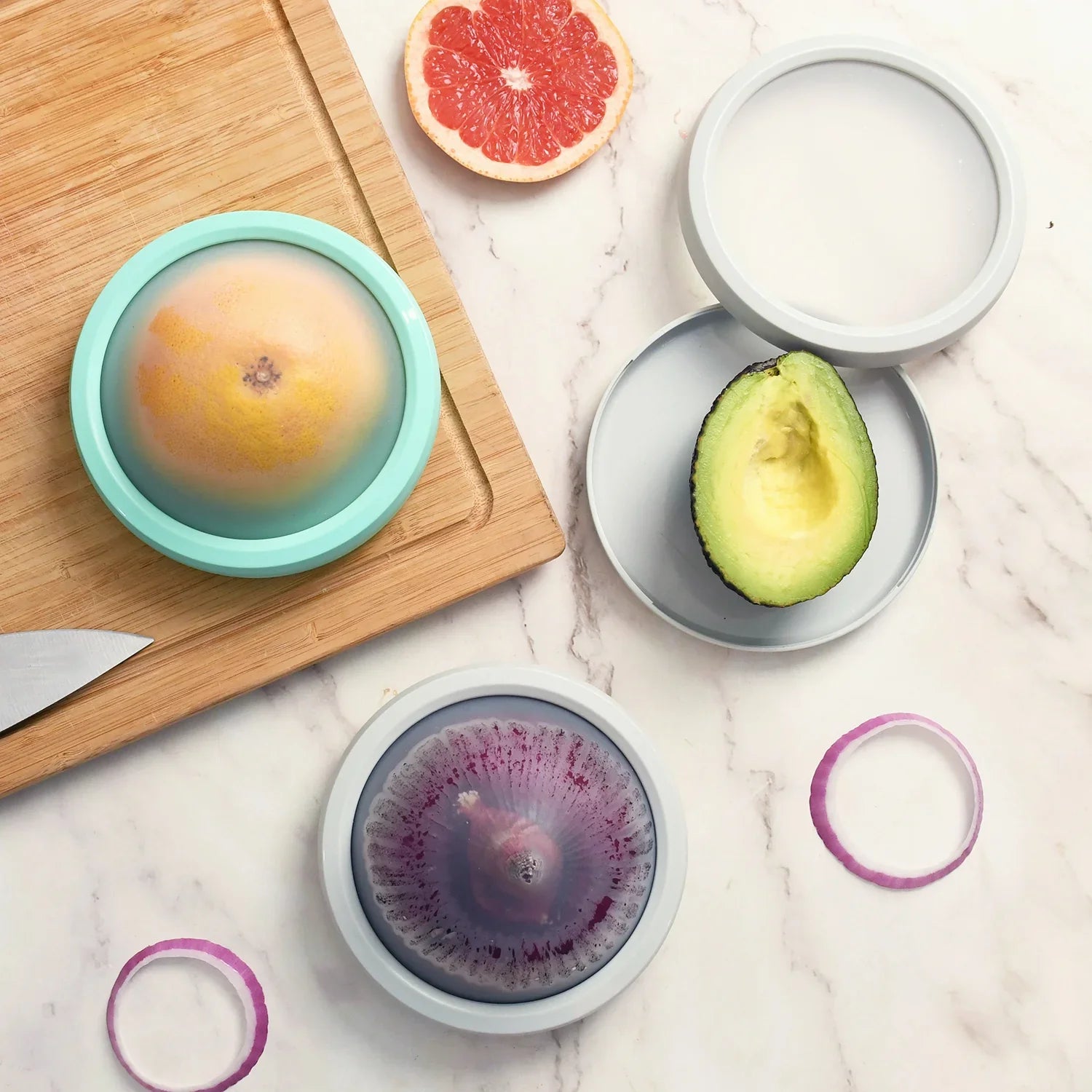 DeliOne Flex’n Fresh Stretch Pod silicone cover hugging half fruit or veggie