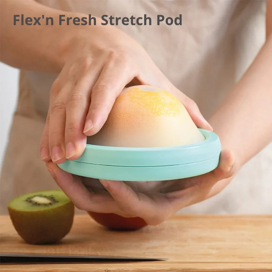 DeliOne Flex’n Fresh Stretch Pod silicone cover hugging half fruit or veggie