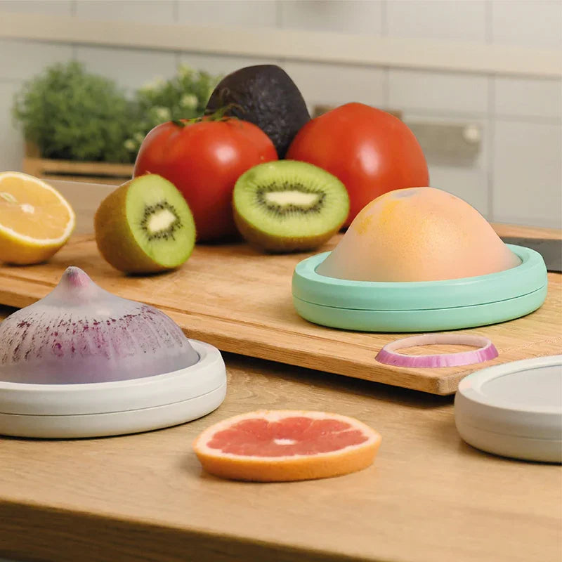 DeliOne Flex’n Fresh Stretch Pod silicone cover hugging half fruit or veggie