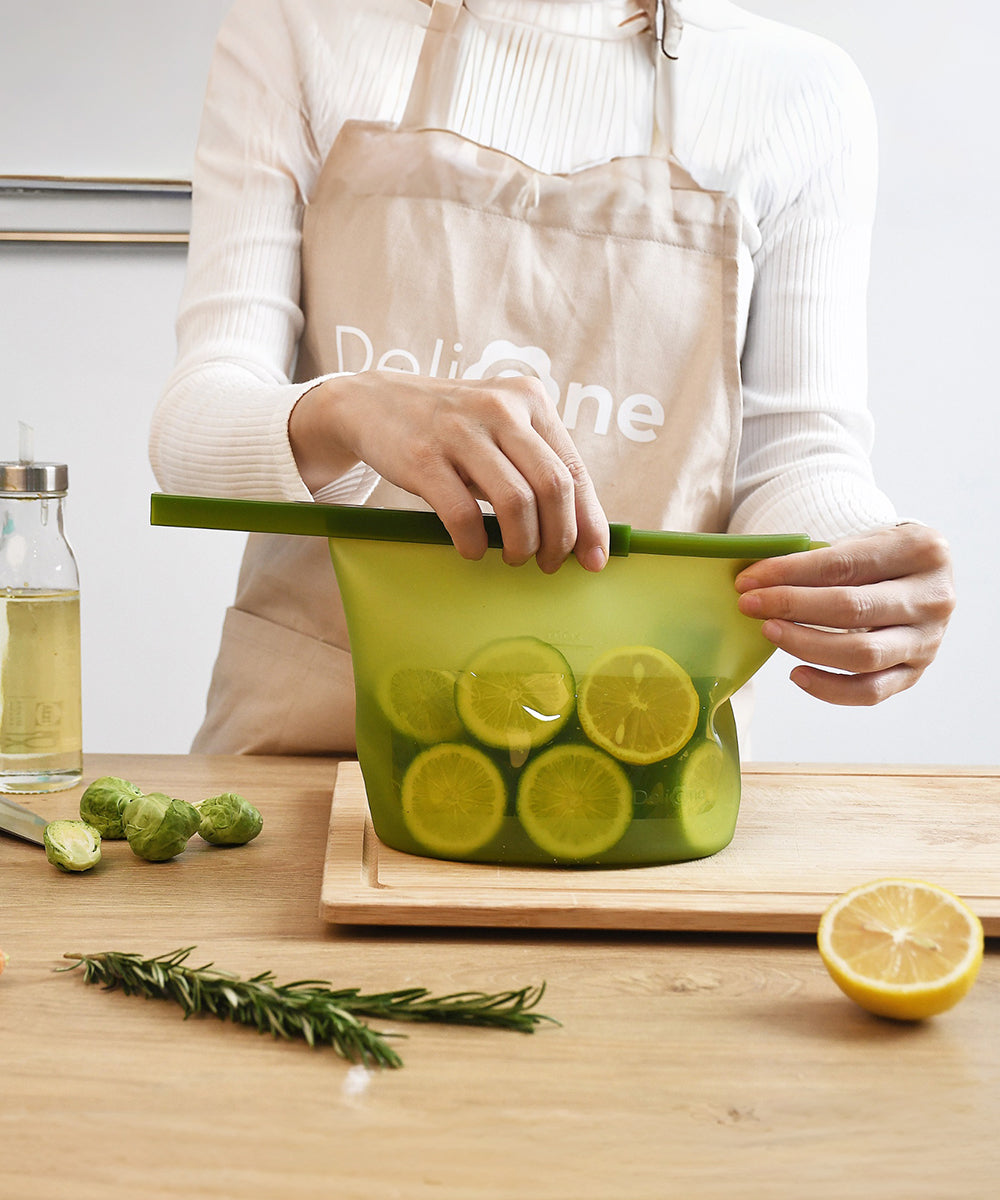 Minimalist food storage scene with DeliOne silicone containers and fresh ingredients